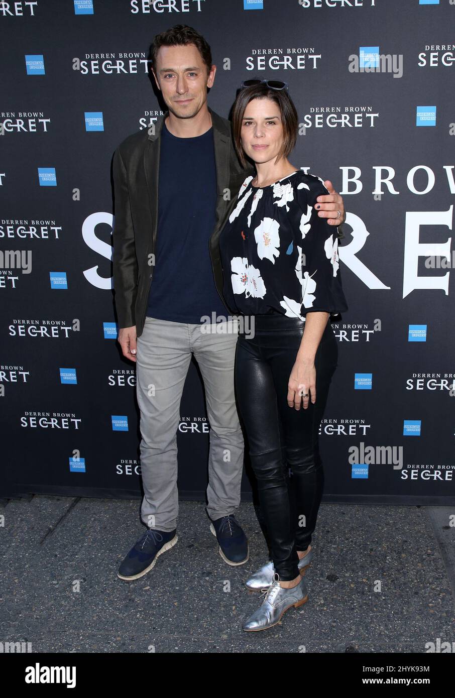 Neve Campbell & Husband JJ Feild attending the Derren Brown Secret