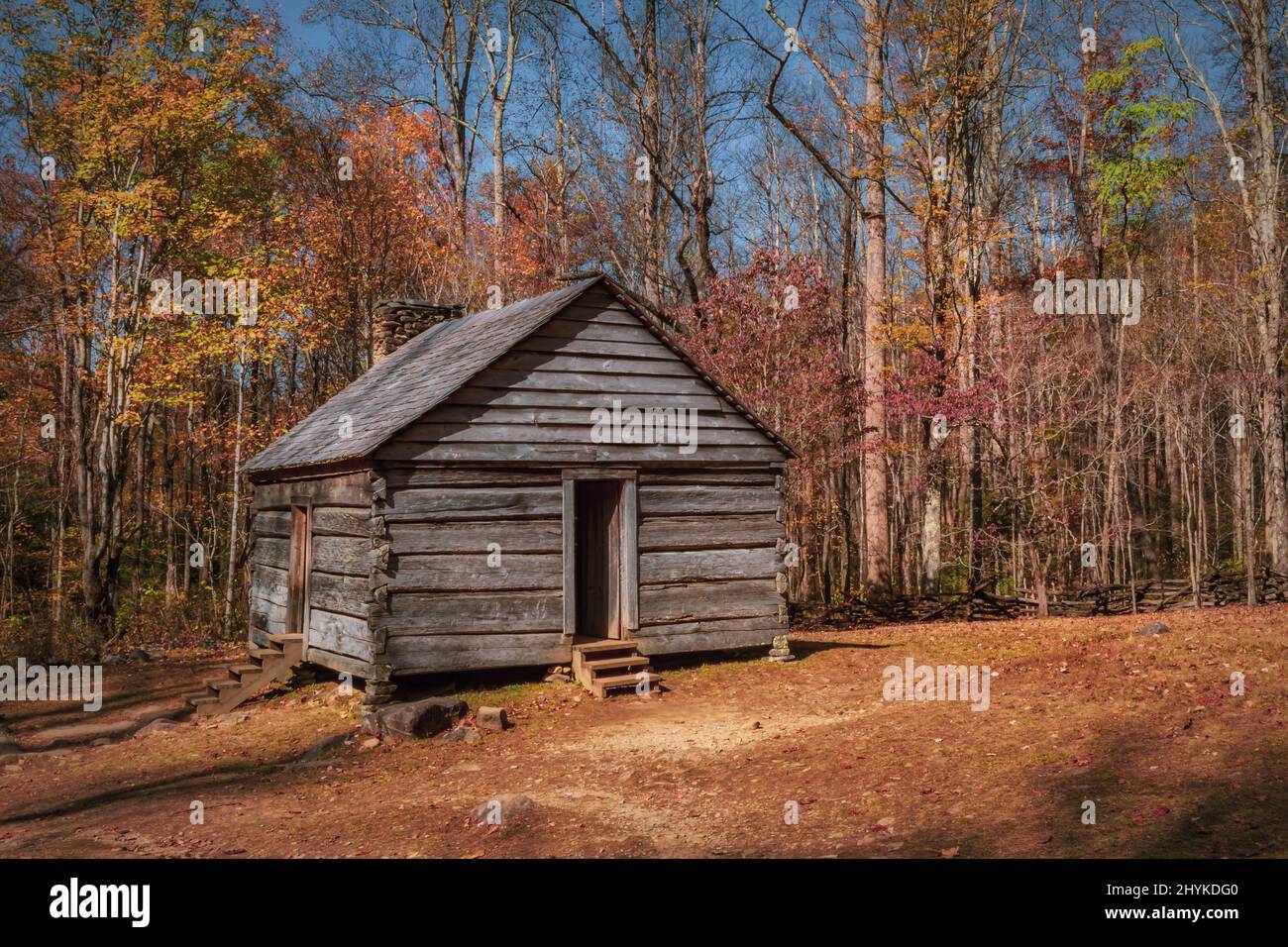 Old wooden cottage against the autumn forest Stock Photo - Alamy