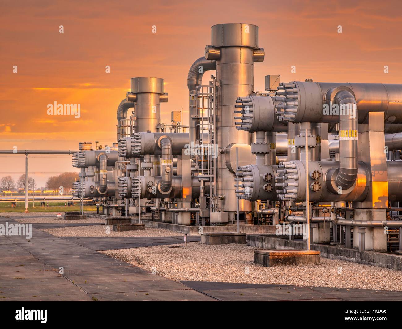 Oil and gas processing plant in the Groningen Gas Field area with pipe line valves. This is one of the few natural gas fields in Europe. Stock Photo