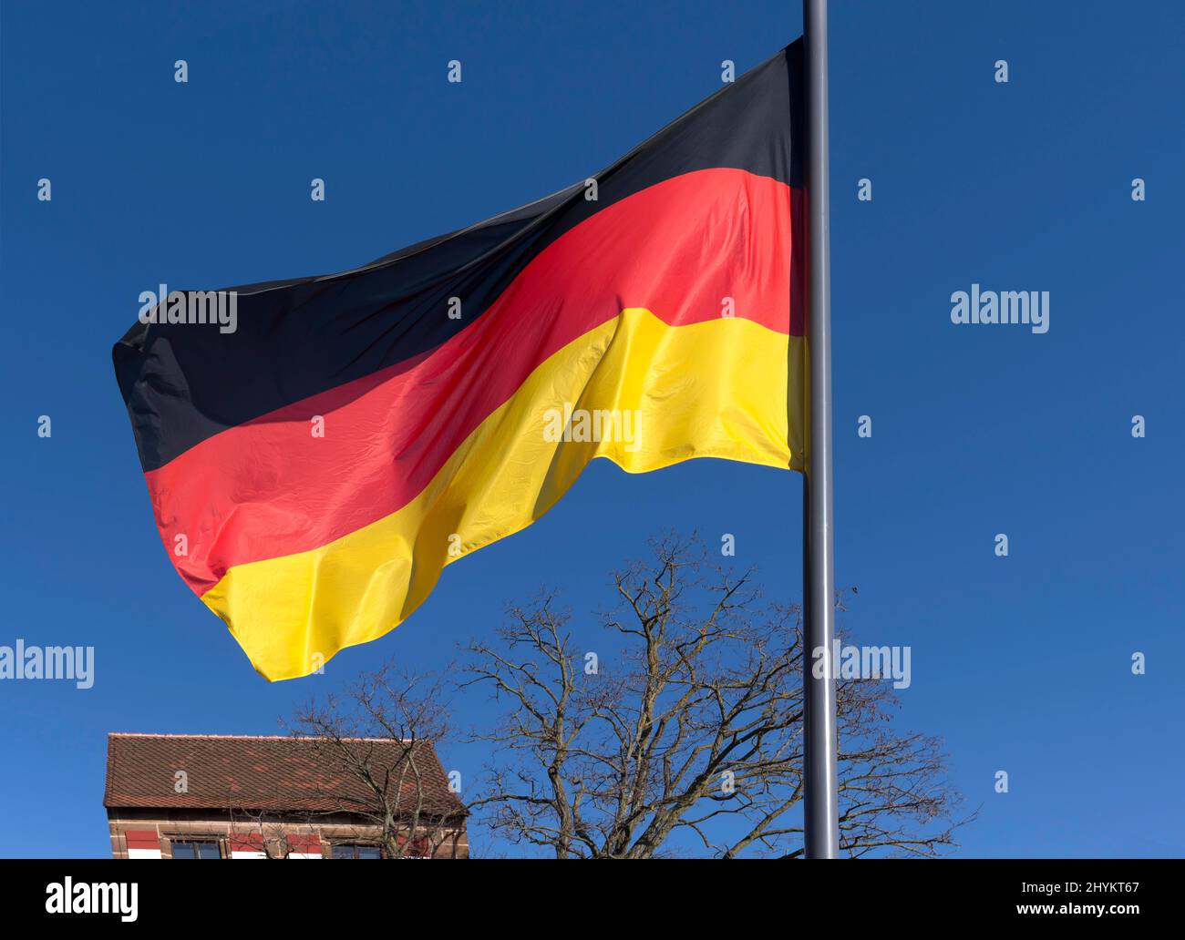 Waving German flag, blue sky, Nuremberg, Middle Franconia, Bavaria, Germany Stock Photo