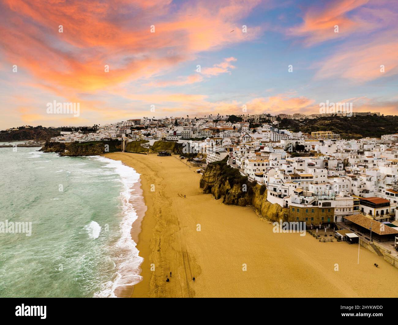Aerial view of whitewashed architecture of Albufeira by the Atlantic Ocean at sunset, townscape, Algarve, Portugal Stock Photo