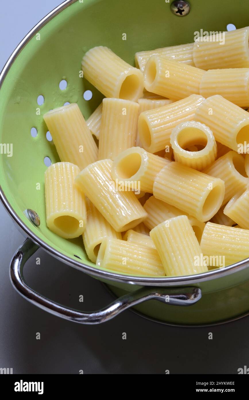 Rigatoni, cooked pasta in drainer, pasta, Italy Stock Photo
