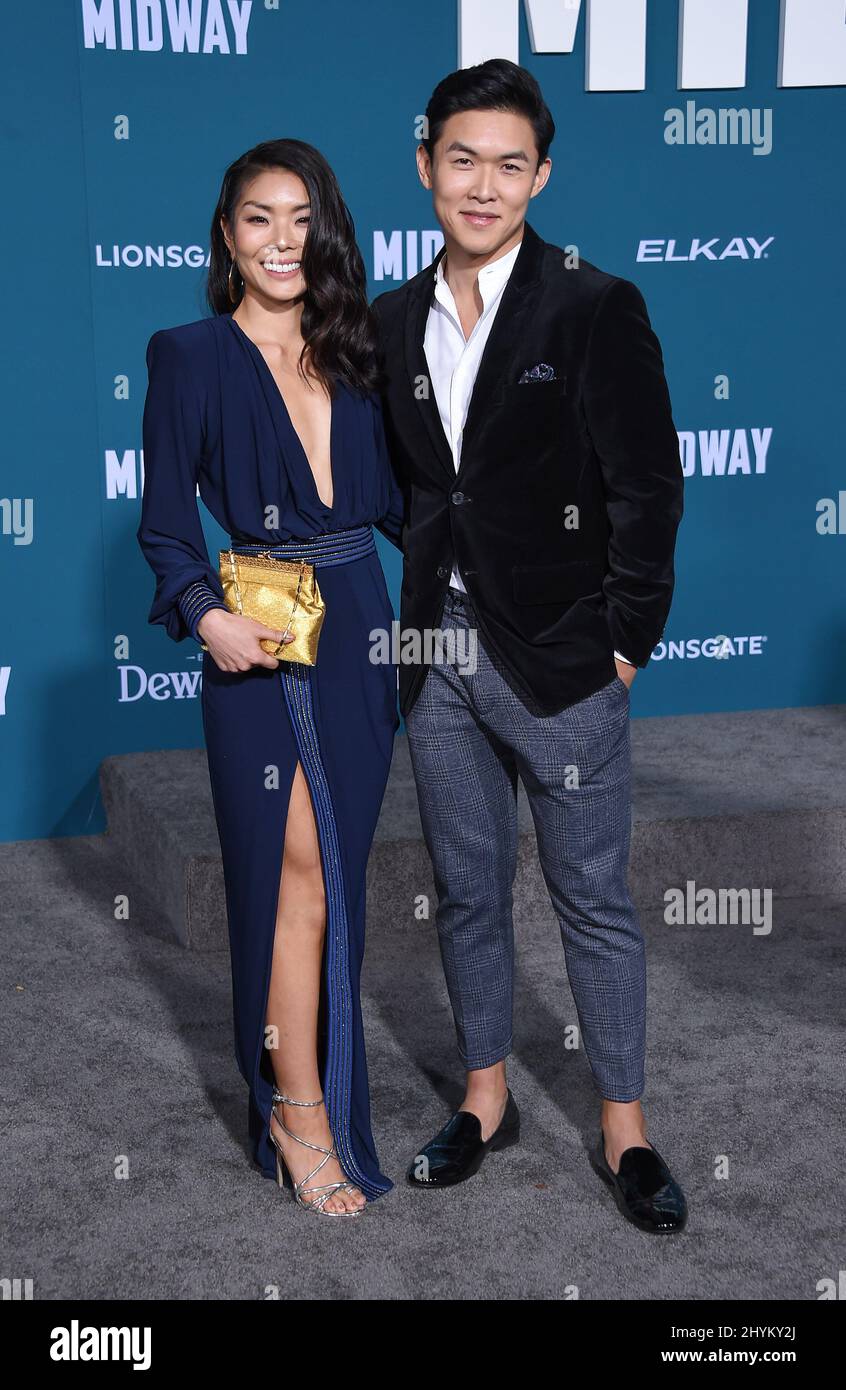 Kenny Leu and Masumi attending the World premiere of Midway Stock Photo ...