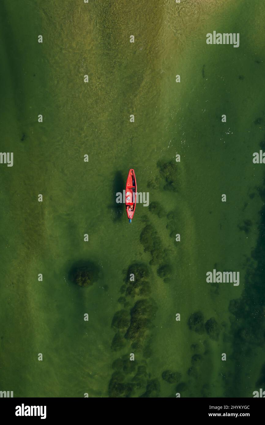 Vertical bird's eye view of the boat on the water surface. Australia ...