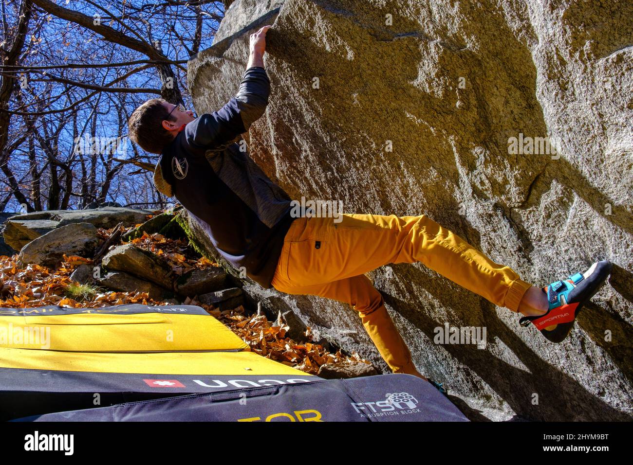 Man bouldering in Chironico, Canton Ticino, Switzerland Stock Photo