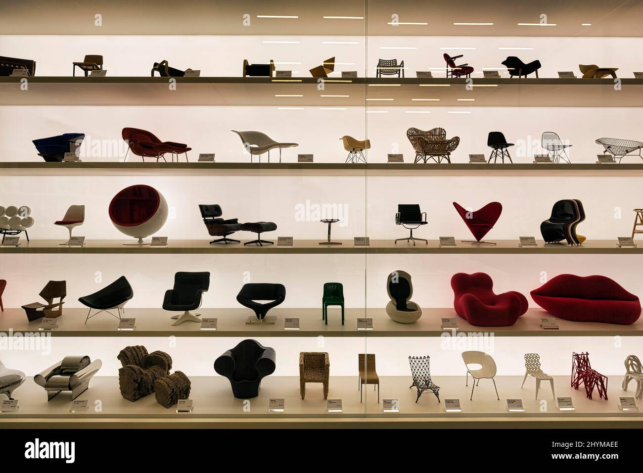 Many different miniature chairs in a showcase Vitra Schaudepot