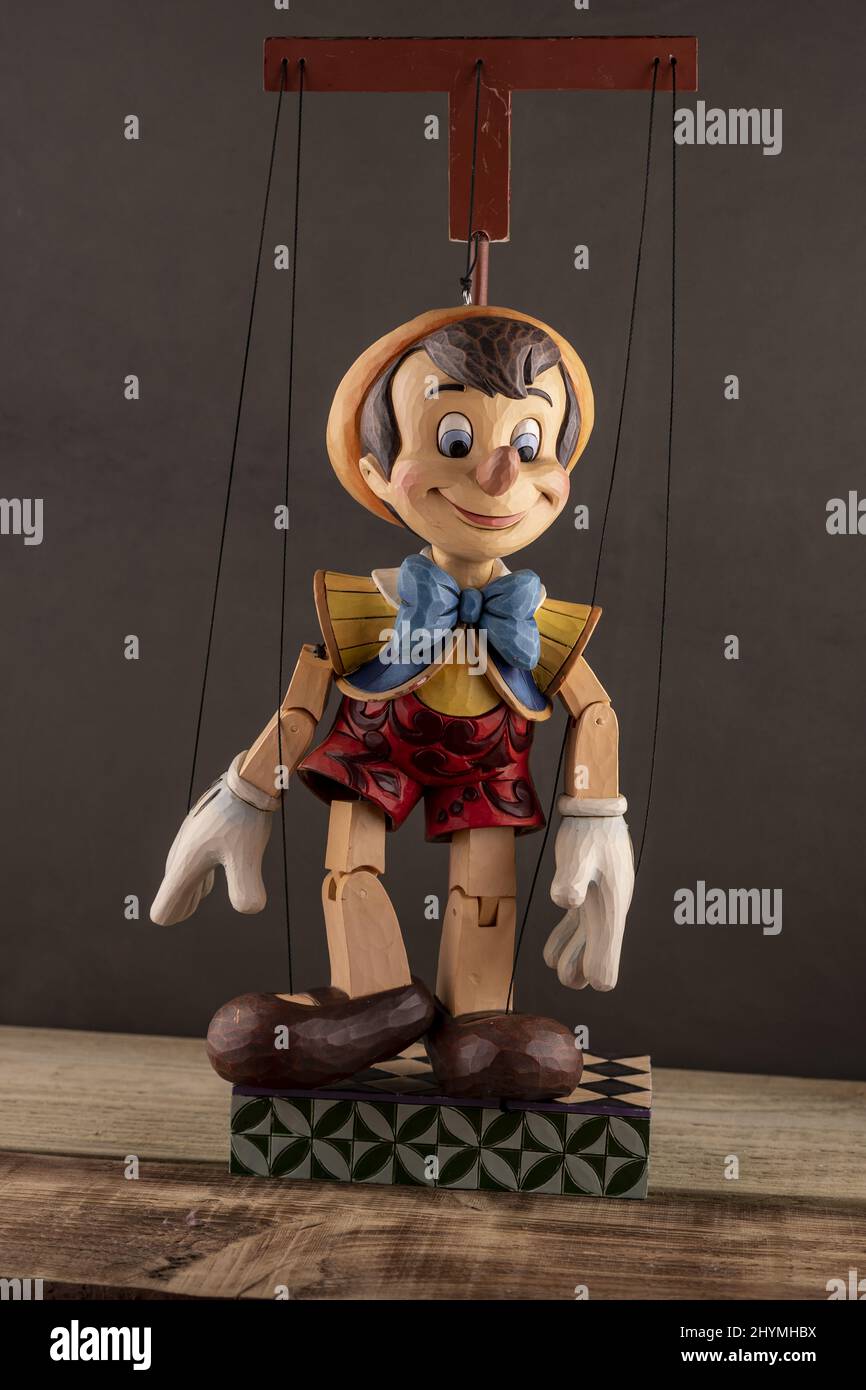 Closeup of Pinocchio puppet marionette on wooden stage Stock Photo