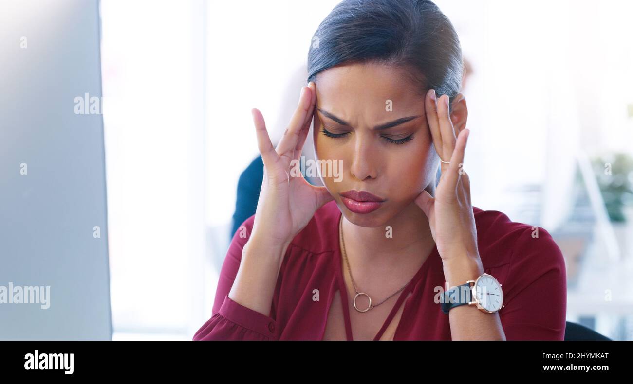 My brain is going to explode. Cropped shot of a stressed young ...