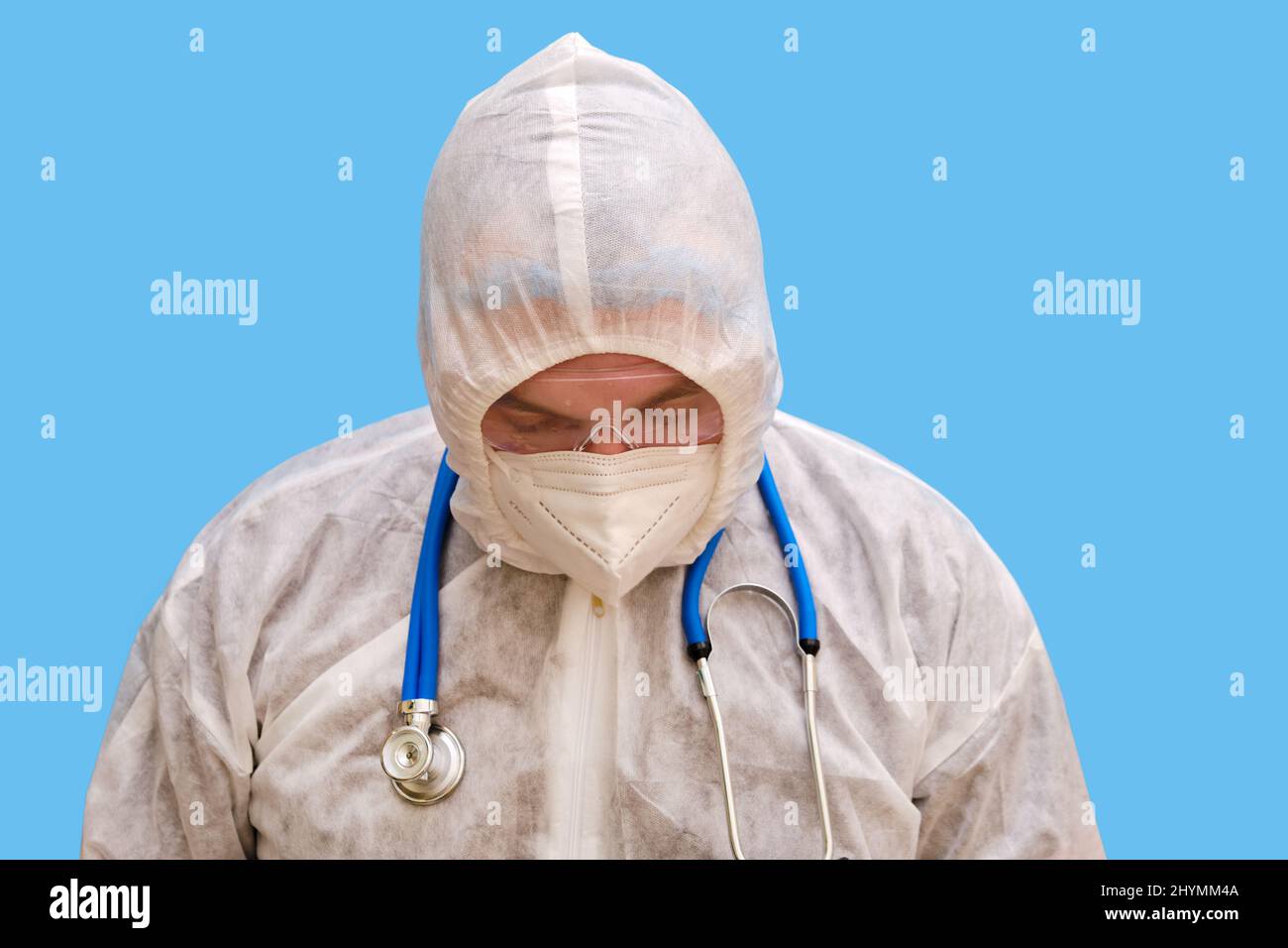 Man doctor medic in a protective suit uniform with goggles and face ...