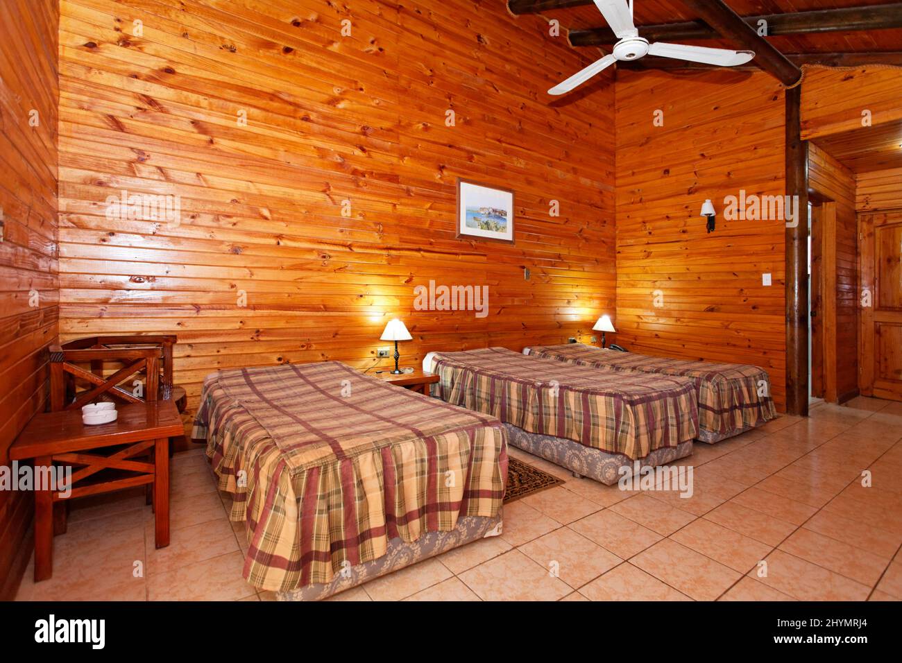 Room in log cabin, wooden house, simple, bunglow, indoor, hotel, bungalow complex, Maria la Gorda, Pinar del Rio province, Cuba, Caribbean Stock Photo
