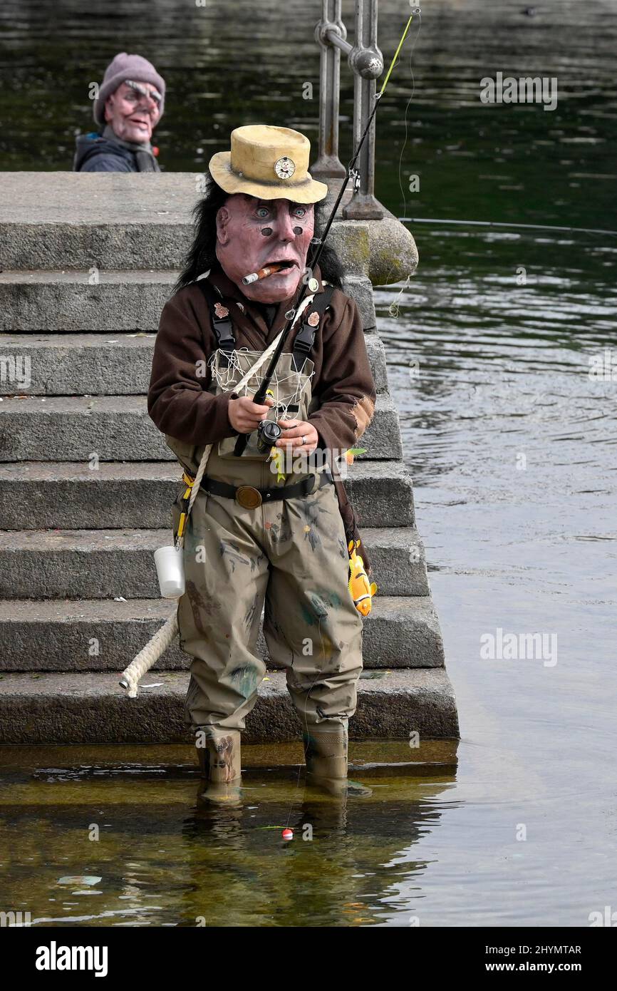 Fasnachtler fishing, carnival parade, parade with dressed up people, Switzerland Stock Photo