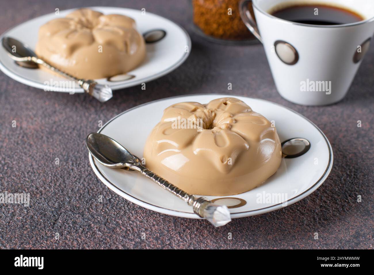 Coffee dessert made from cream and gelatin in portion molds on a brown