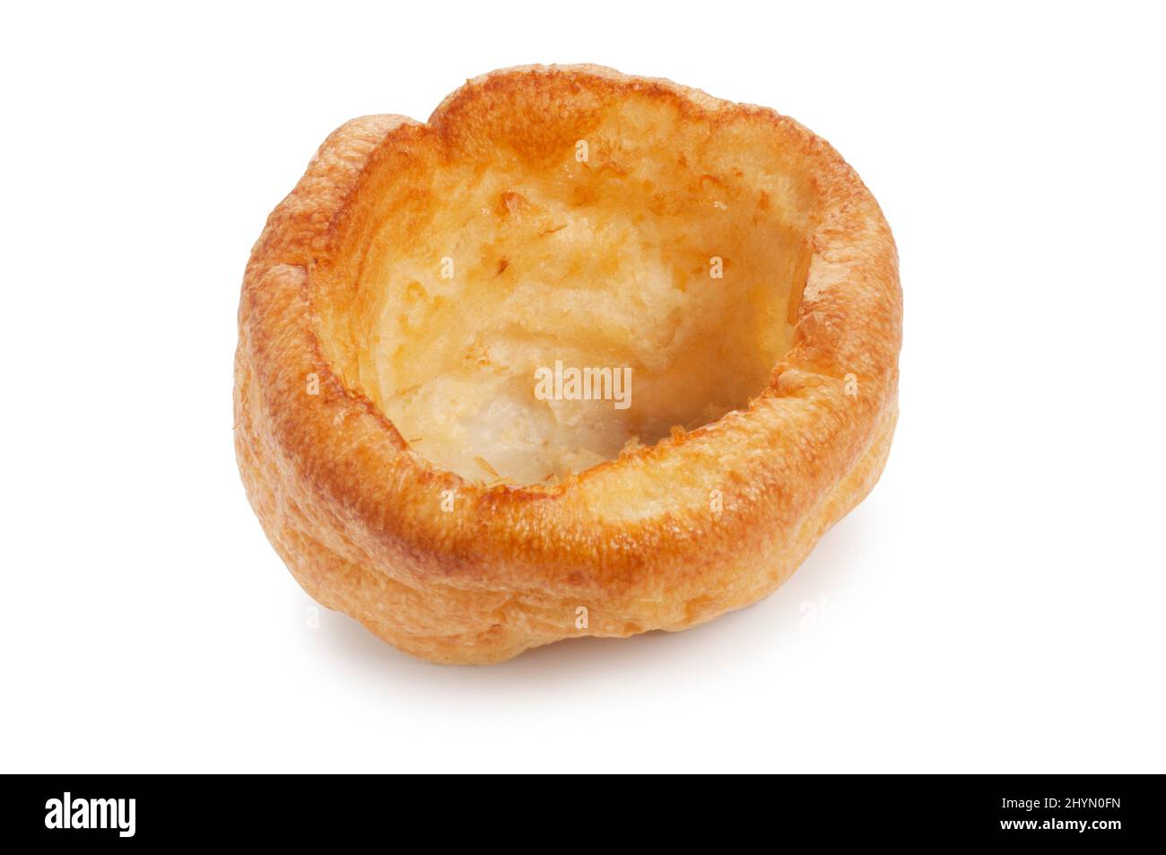 Studio shot of a baked Yorkshire Pudding cut out against a white background - John Gollop Stock Photo