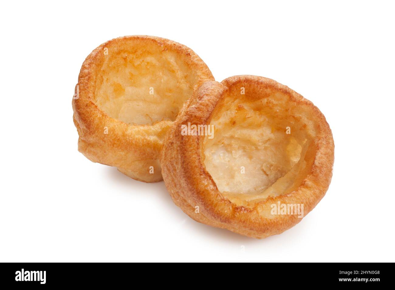 Studio shot of baked Yorkshire Puddings cut out against a white background - John Gollop Stock Photo