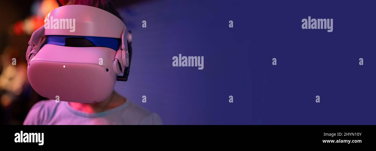 vr game and virtual reality. kid girl gamer eight years old fun playing