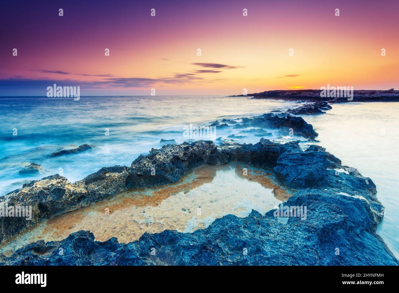 Amazing morning sun over the sea. Volcanic island of Malta. Qawra