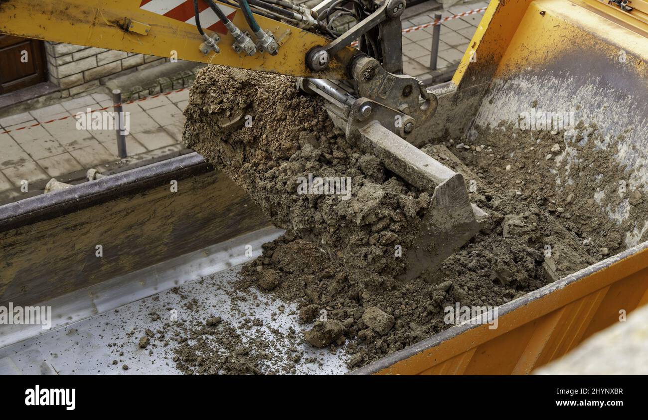 Excavator crane in street works, construction and industrial