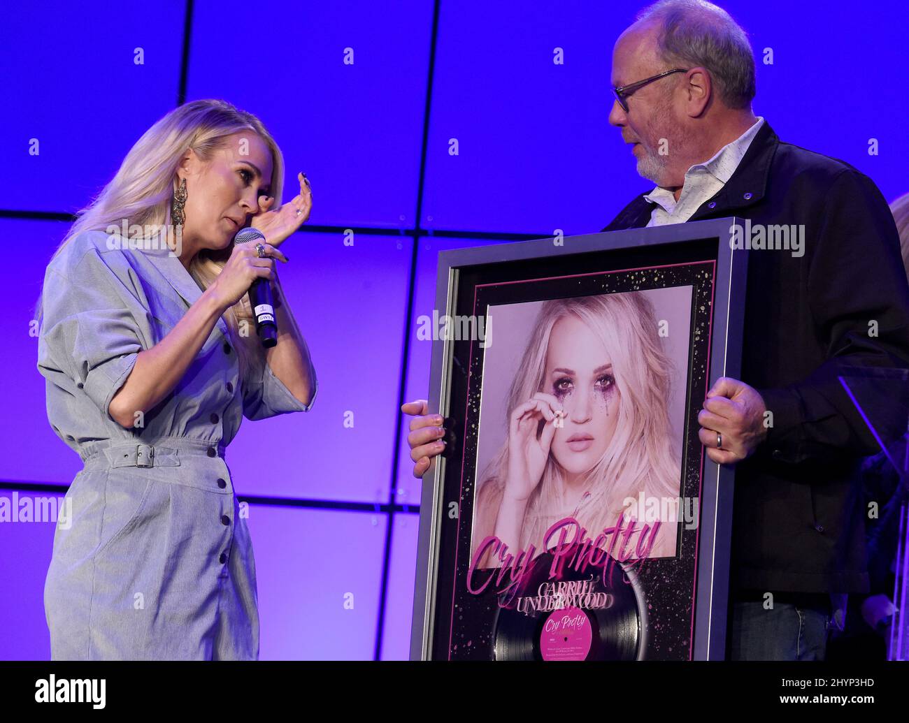 Carrie Underwood is surprised onstage with a certified platinum album for 'Cry Pretty' during the Country Radio Seminar 2020 held at the Omni Nashville on February 20, 2020 in Nashville, TN. Stock Photo