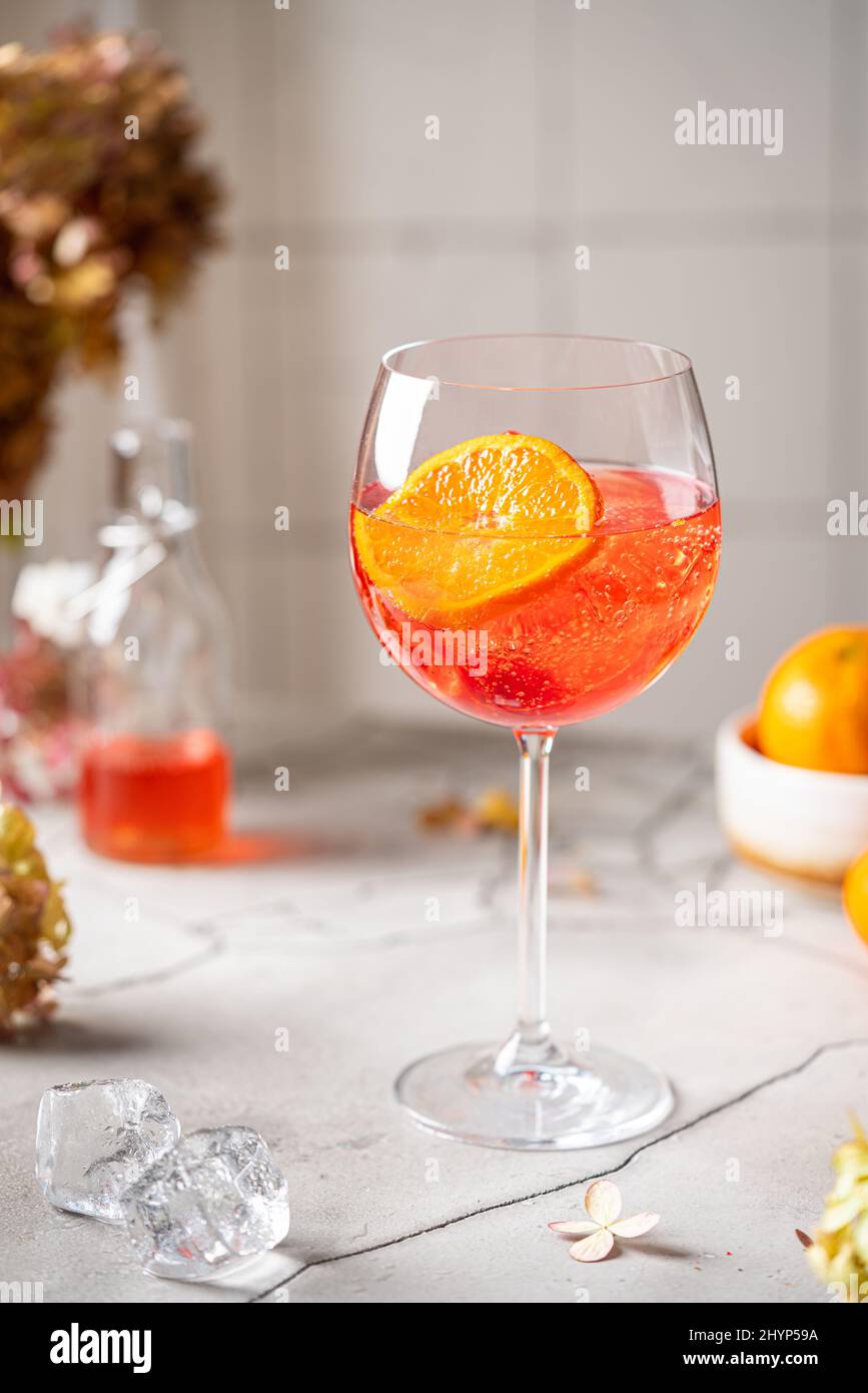 Italian Aperol Spritz cocktail with orange slices on gray stone table ...