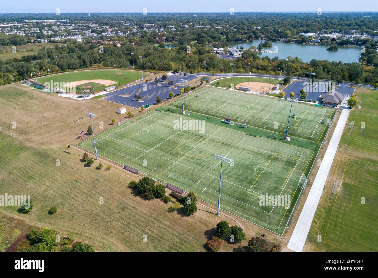 Aerial view of a high school playfield with baseball diamonds and a