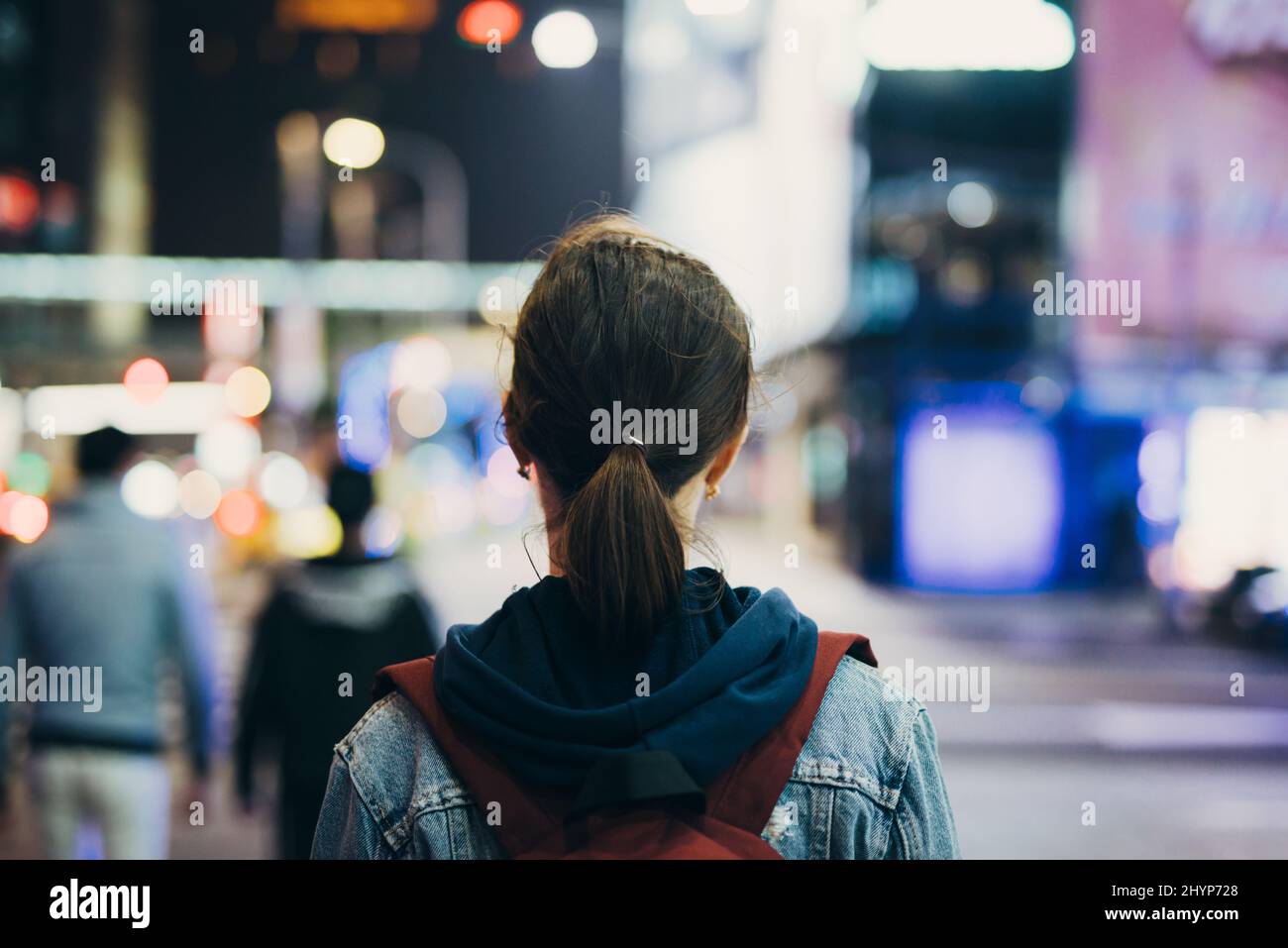 Woman street night rear view hi-res stock photography and images - Alamy