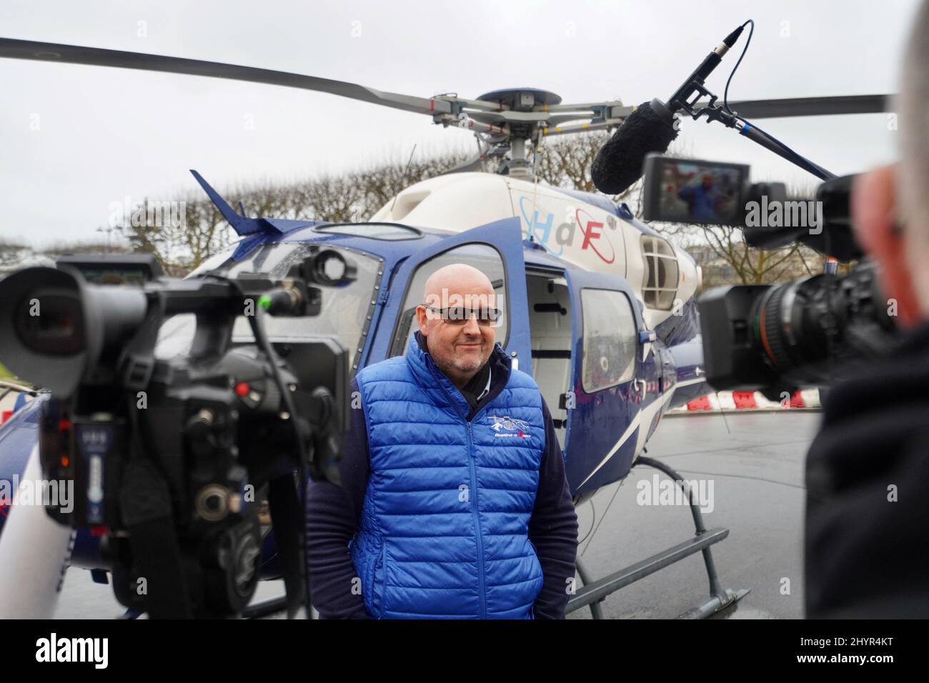 Franck Charlet the pilote member of helicopter of France, poses in front of the Eiffel Tower with the Eurocopter AS355N Ecureuil 2 after he installed the new antenna at the top of the Eiffel Tower in Paris, France, on March 15, 2022. Photo by ABACAPRESS.COM Stock Photo