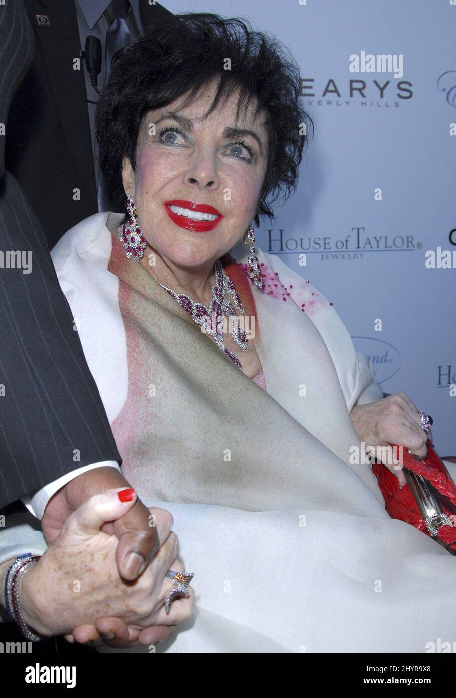 Dame Elizabeth Taylor attending the House of Taylor Holiday Collection