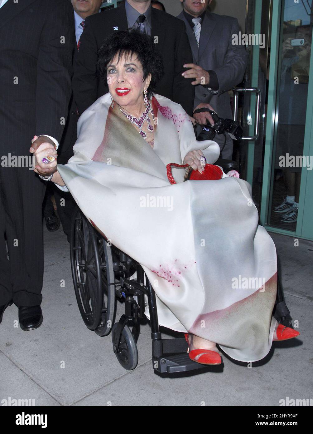 Dame Elizabeth Taylor attending the House of Taylor Holiday Collection