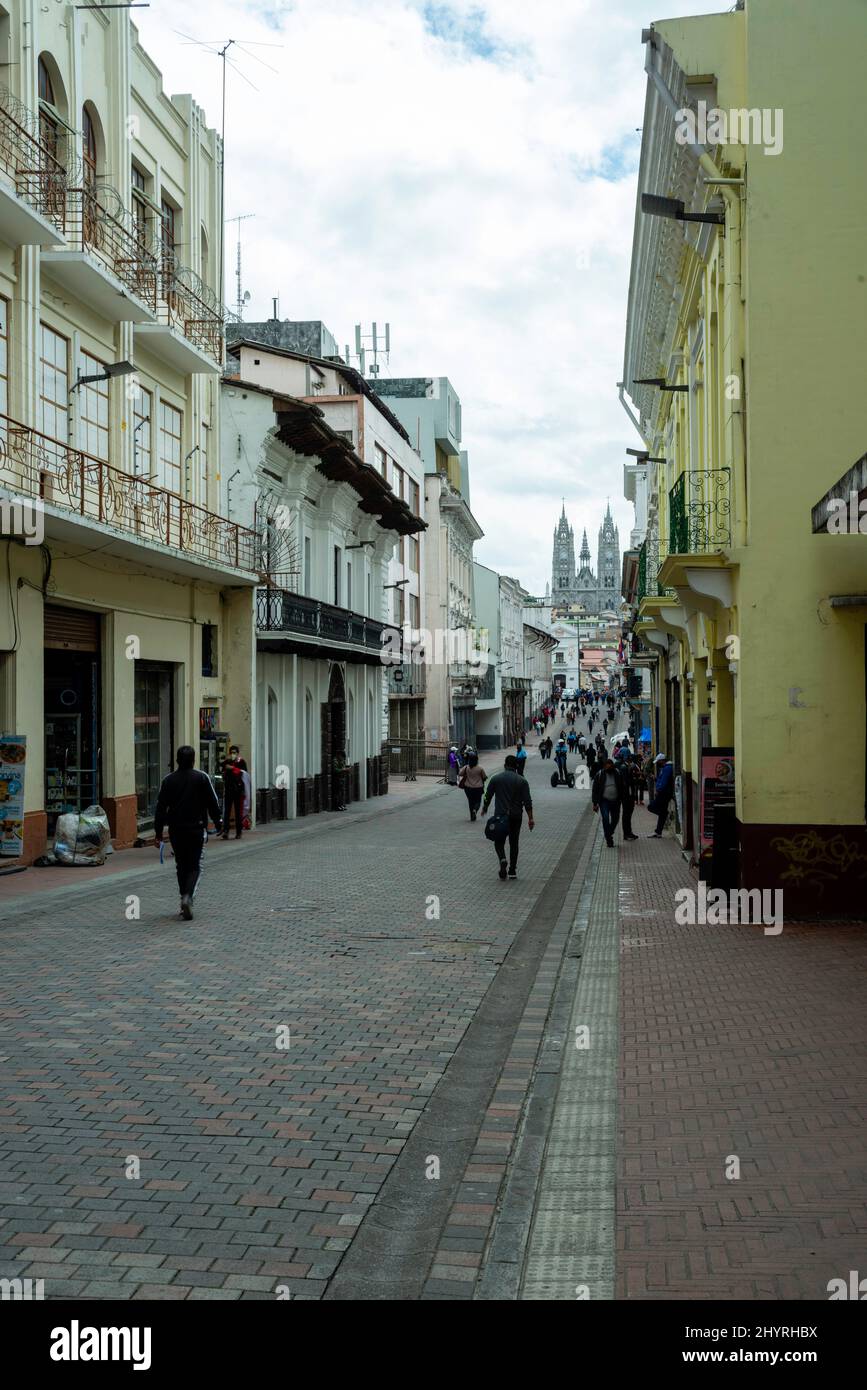 Quito street scene with the Basilica del Voto Nacional in the distance