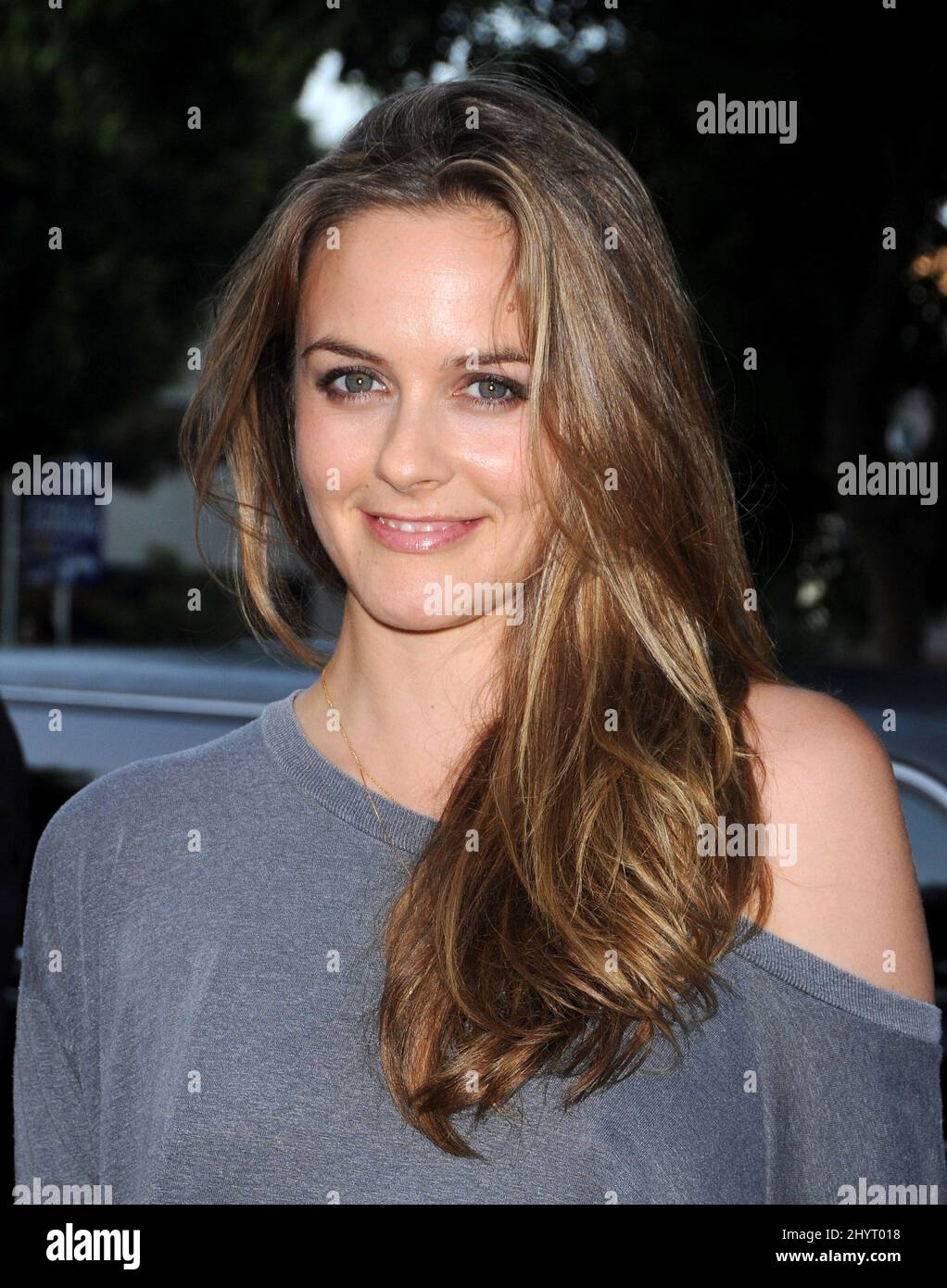 Alicia Silverstone and guest arriving for the premiere of Pineapple