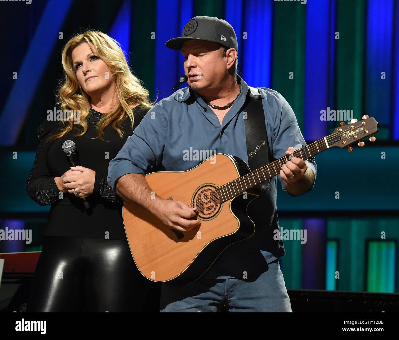 Trisha Yearwood and Garth Brooks performing onstage at Loretta Lynn's Friends: Hometown Rising benefit concert with proceeds benefiting the United Way of Humphreys County on September 13, 2021 in Nashville, TN. Stock Photo