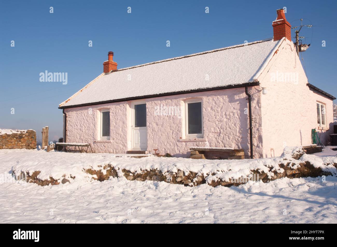 Traditional Pembrokeshire cottage in snow, Marloes Mere, Pembrokeshire