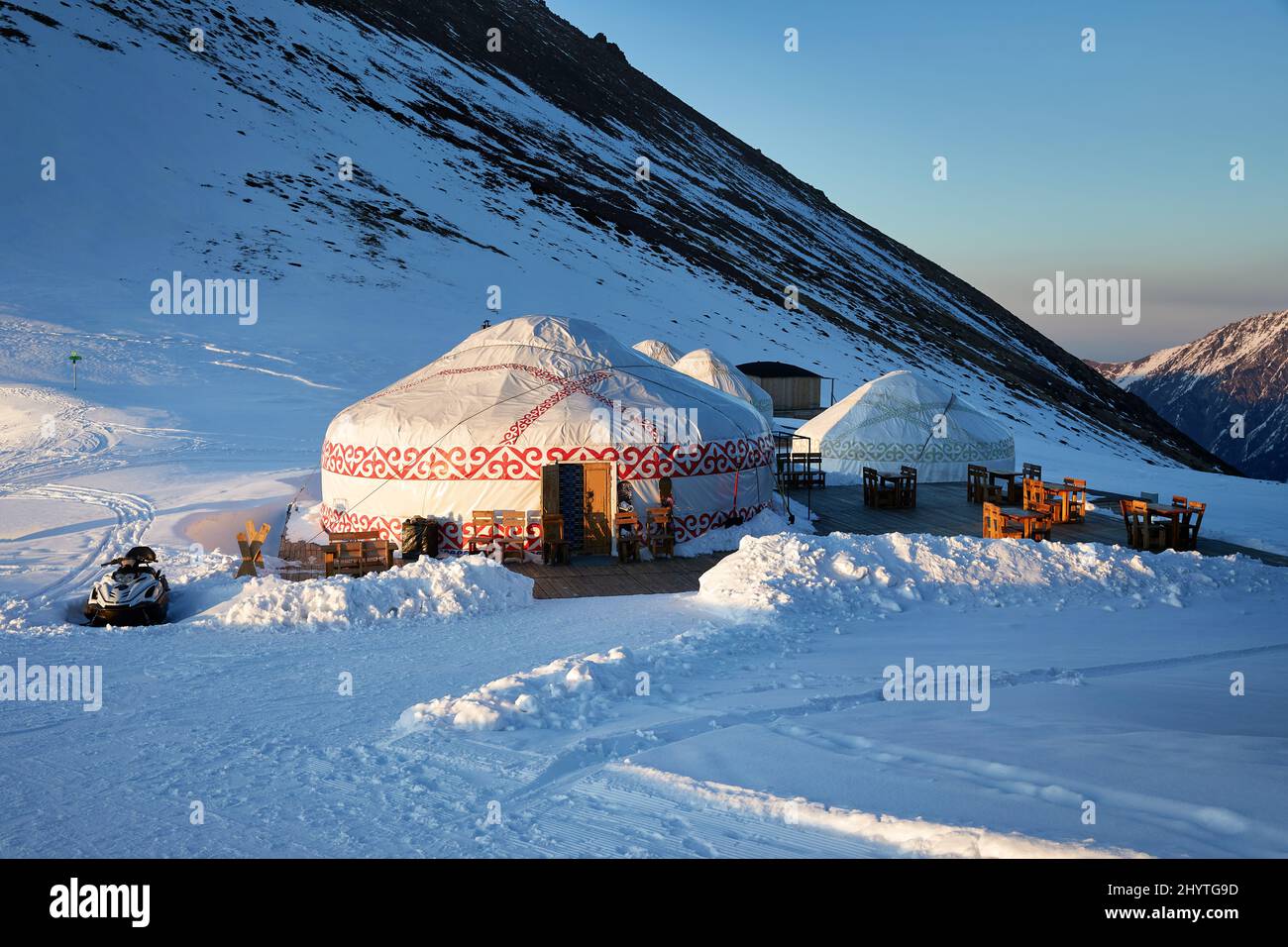 Hotel and Restaurant from Yurt nomadic house complex at Ski resort Shymbulak in Almaty, Kazakhstan. Winter snowfall outdoor tourism concept. Stock Photo