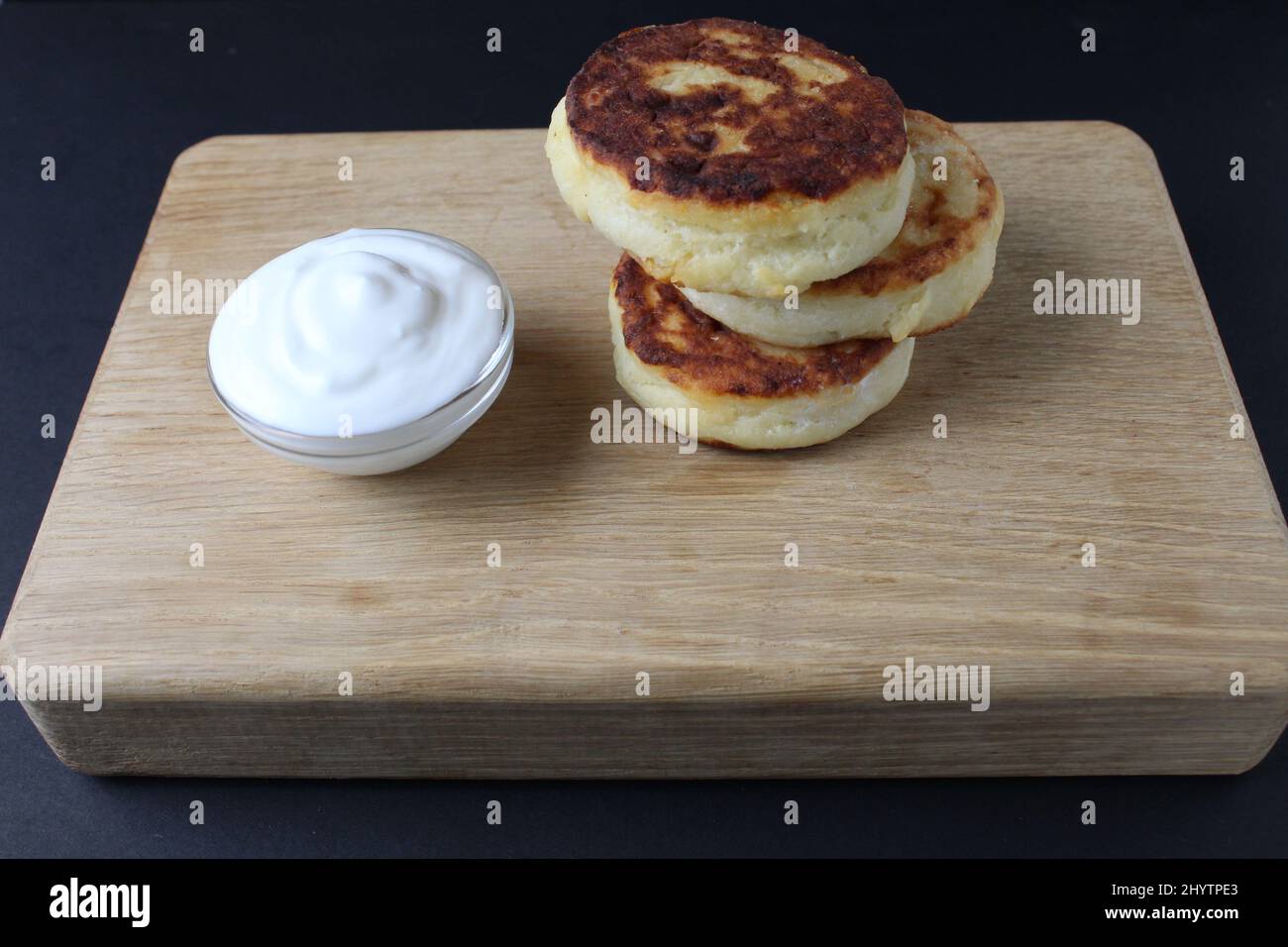 breakfast cottage cheese pancakes cheesecakes on a wooden tray with