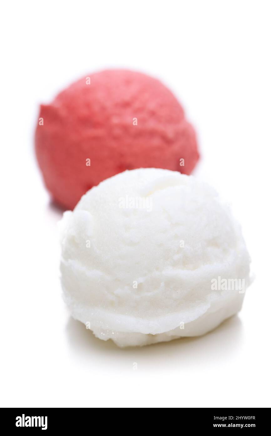 One scoop of strawberry and one scoop of lemon ice cream Stock Photo