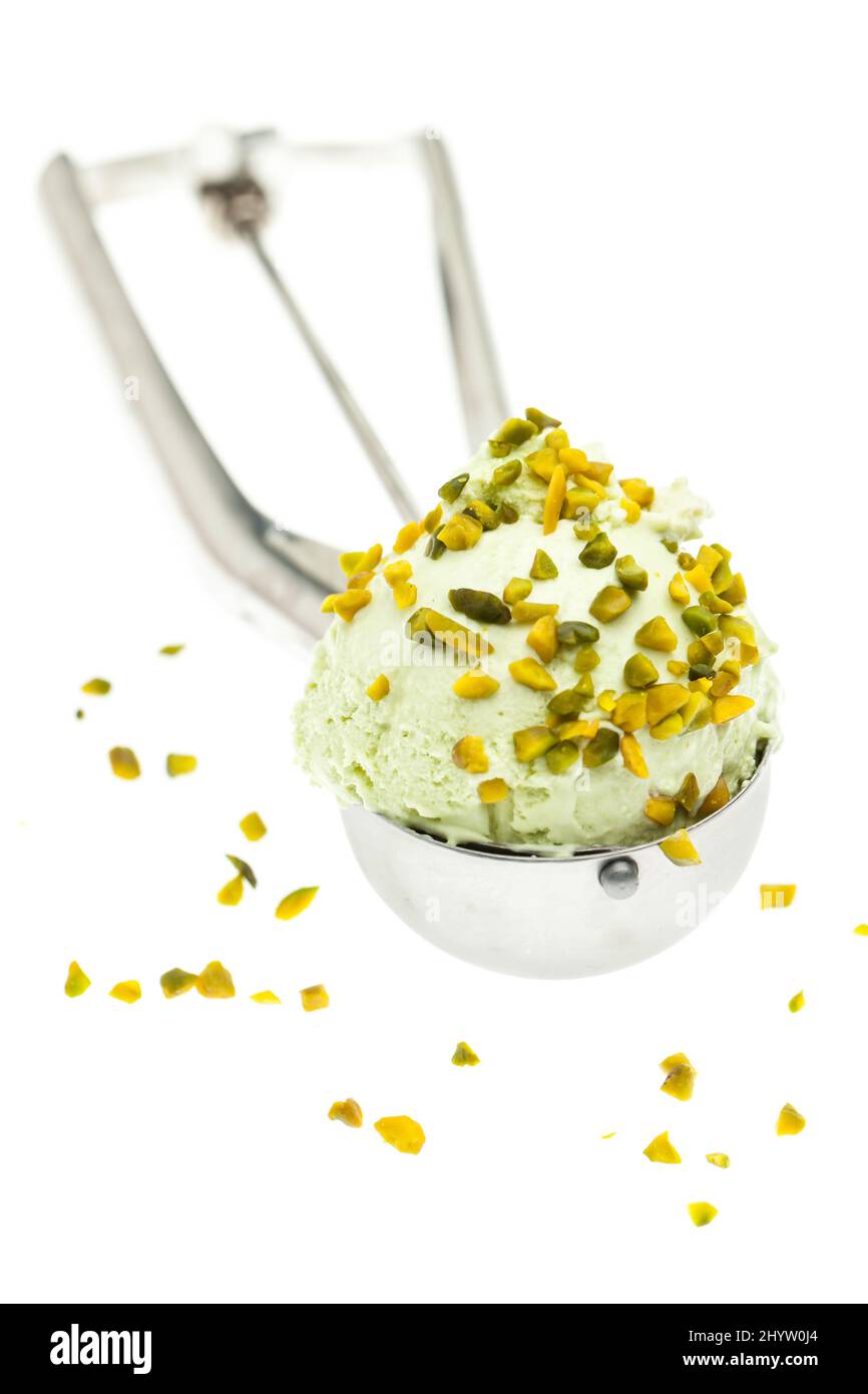 Pistachio ice cream in ice cream spoon on a white background Stock Photo