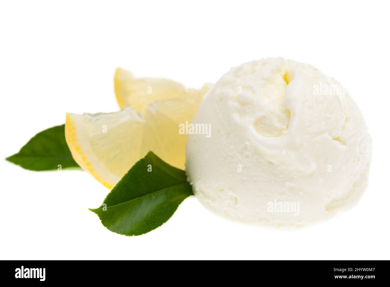 single lemon ice cream scoop from the front on a white background with lemon slices Stock Photo