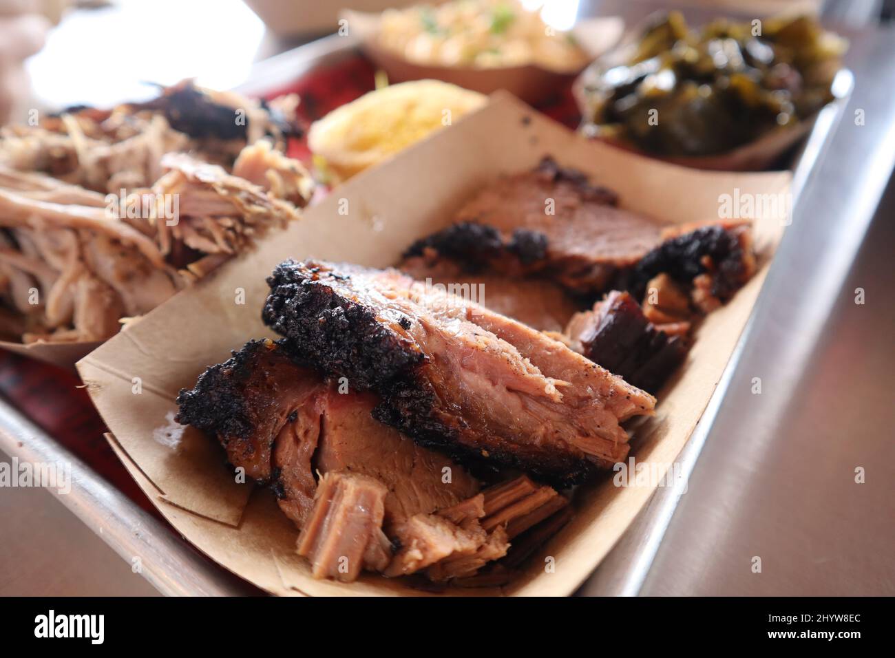 Closeup photo of brisket and pulled pork dish with sides Stock Photo
