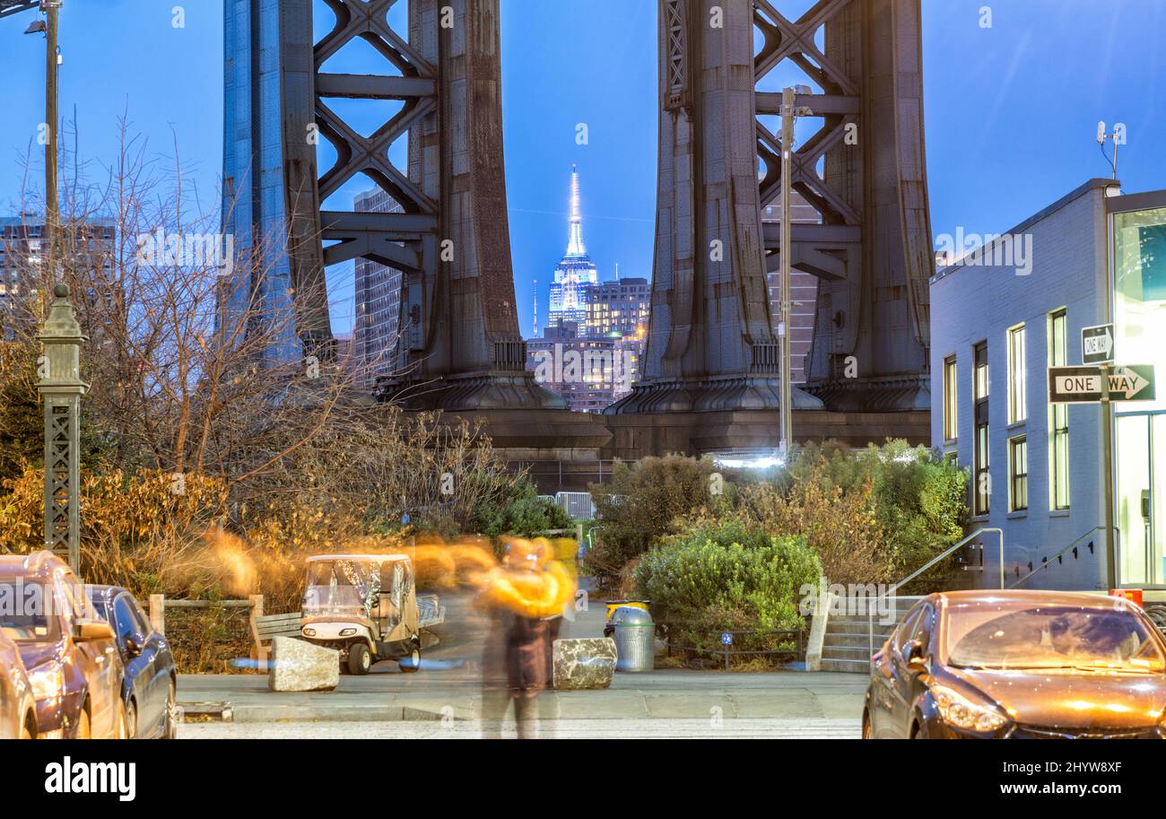Night view of the Empire State Building through the pylons of Manhattan