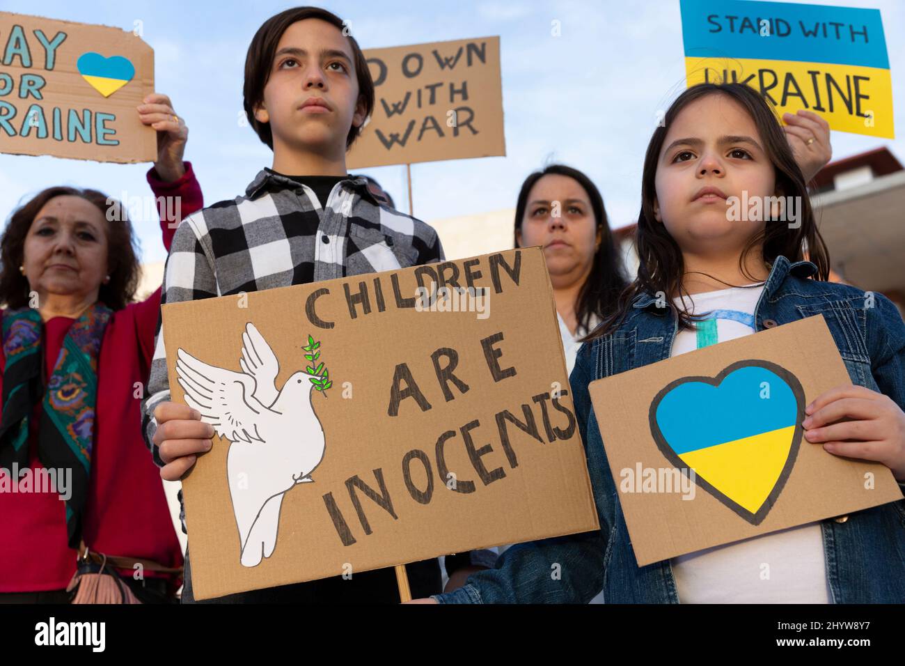 Child activists and others demonstrating against the invasion of Russian troops in Ukraine. Solidarity and support to the Ukrainian people. Stock Photo