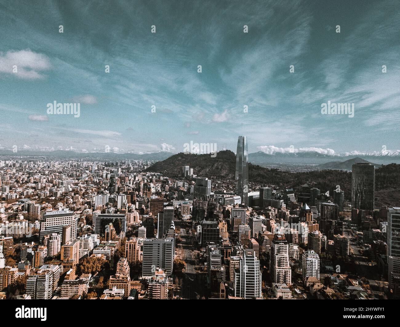 Aerial view over the cityscape buildings under a cloudy sky Stock Photo ...