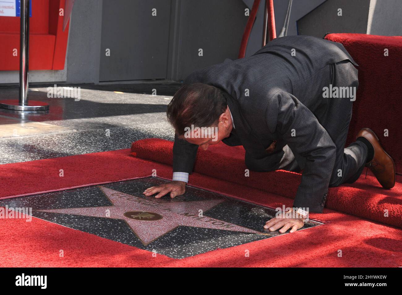 George Hamilton is seen on the Hollywood Walk of Fame as he is honoured with a Star, in Hollywood, California. Stock Photo