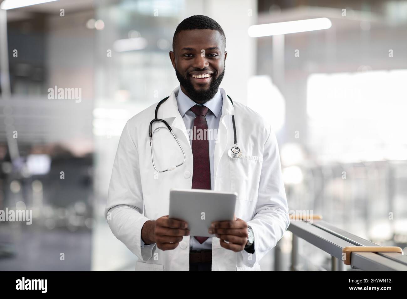 Happy positive black doctor hi-res stock photography and images - Alamy