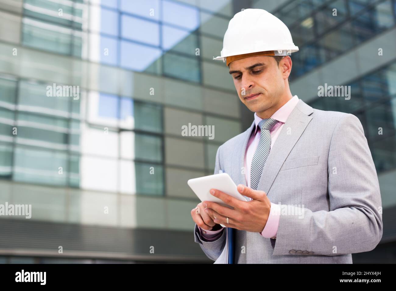 Businessman using touchscreen phone Stock Photo - Alamy