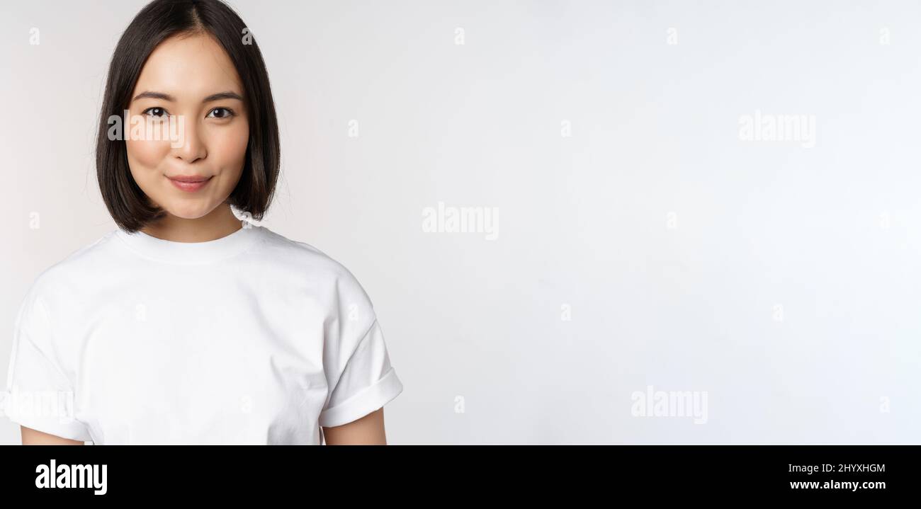 Beautiful teen girl in white t-shirt smiling to camera Stock Photo - Alamy