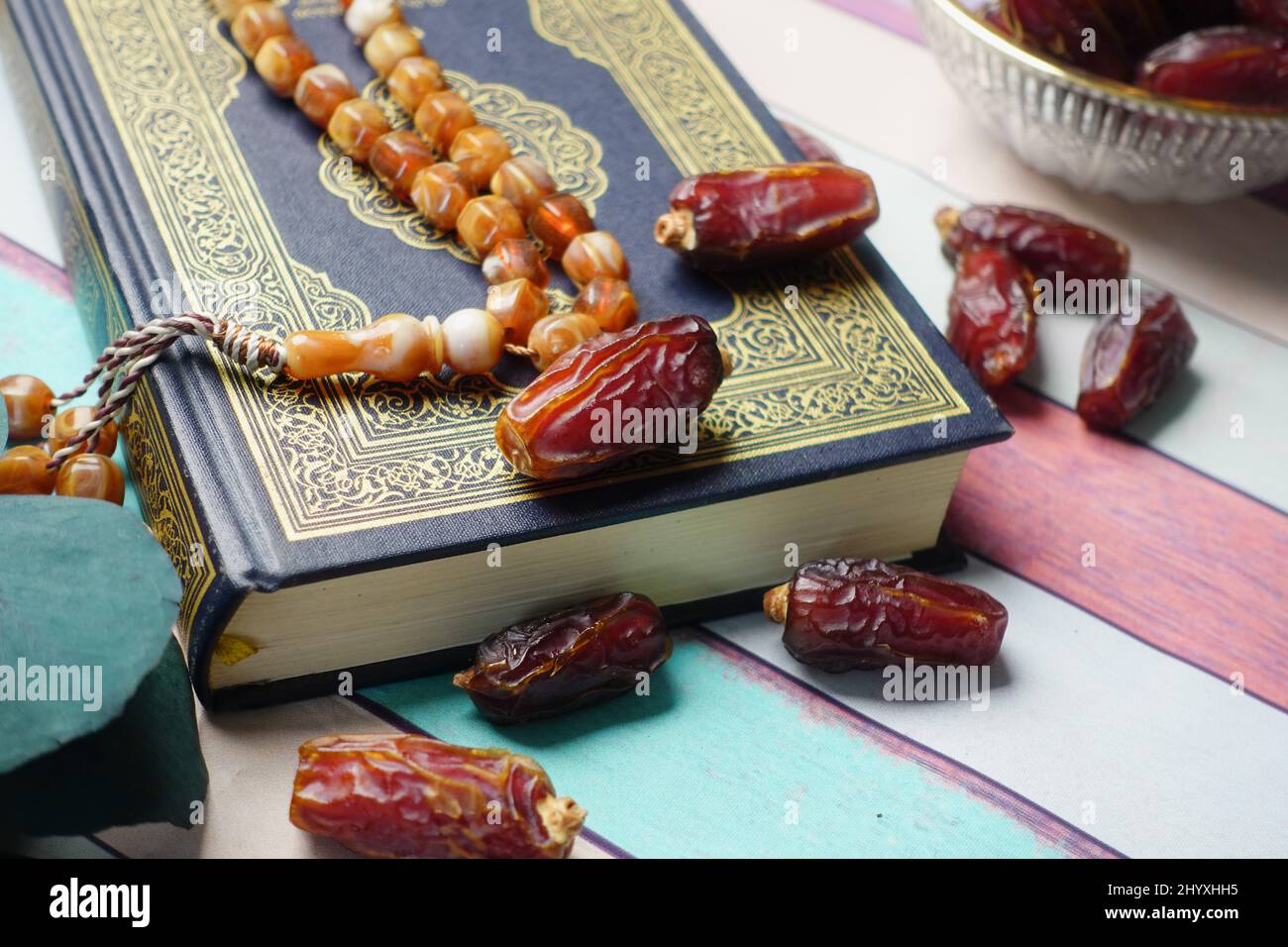 Holy book Quran and rosary on table, close up. Stock Photo