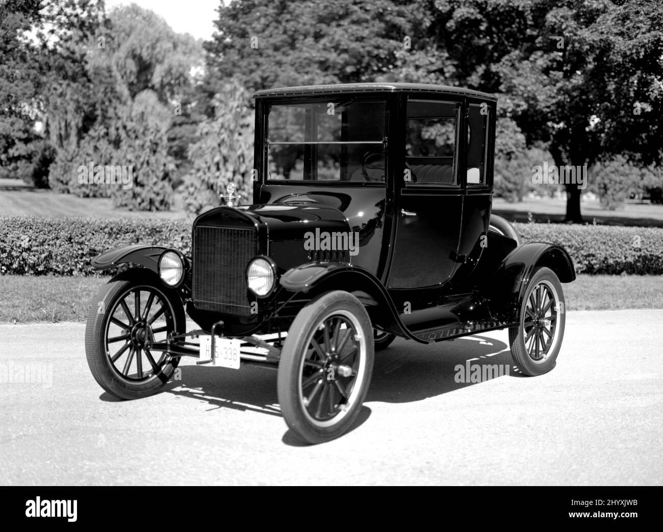 Black and White image of 1923 Ford Model T Coupe on pavement. Stock Photo