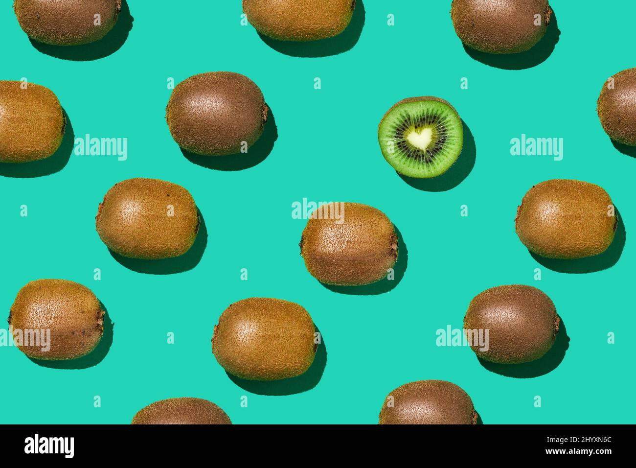 Graphic top view pattern of fresh kiwi fruit in diagonal lines on ...