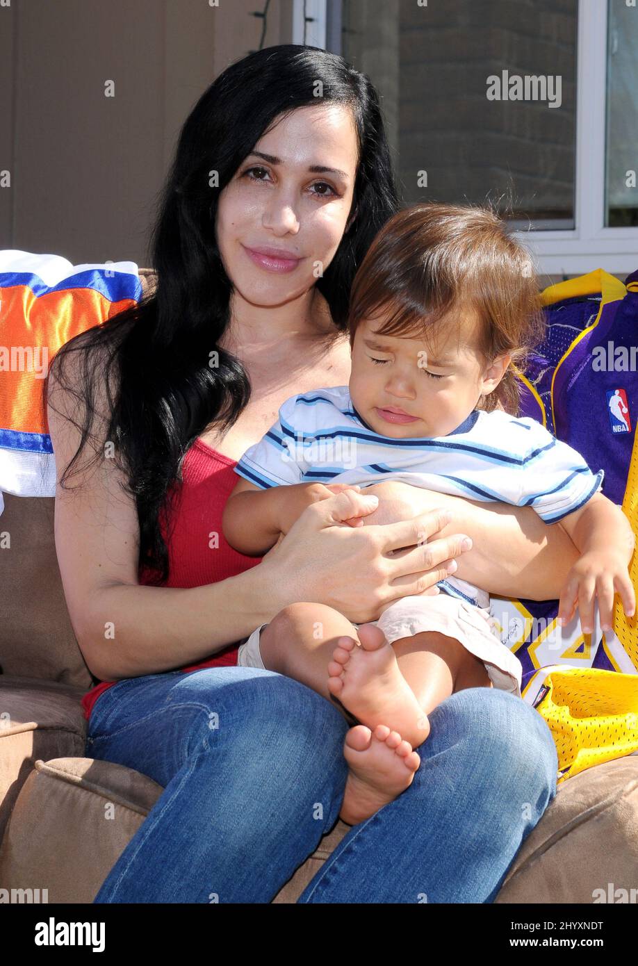 Nadya "Octomom" Suleman and her child at a yard sale held at her home