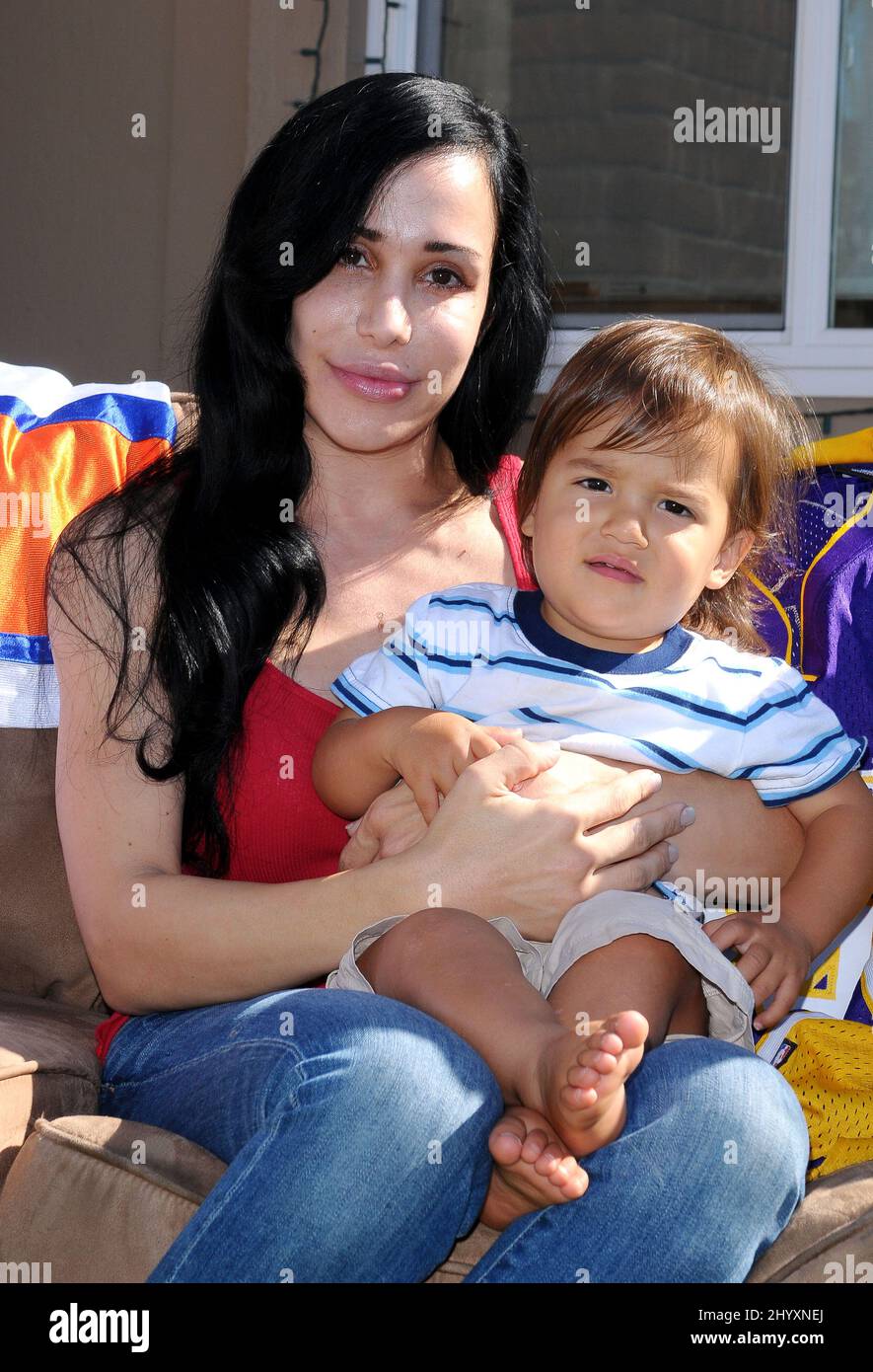 Nadya "Octomom" Suleman and her child at a yard sale held at her home